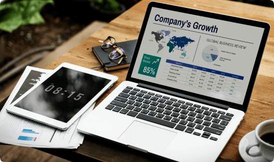 laptop showing company growth report